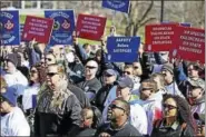  ?? CTNEWSJUNK­IE.COM ?? Public safety workers rally against layoffs last March at the state Capitol.