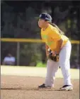  ?? CHRISTIAN YUMOL photo ?? Kylie Yumol plays the infield during a Lanai Little League game.