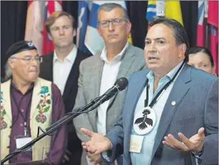  ?? CP PHOTO ?? Perry Bellegarde, national chief of the Assembly of First Nations, addresses a news conference as Clement Chartier, president of Canada’s Metis National Council, New Brunswick Premier Brian Gallant and Newfoundla­nd and Labrador Premier Paul Davis, from...