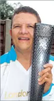  ??  ?? Paul Hardisty carried the Paralympic Torch