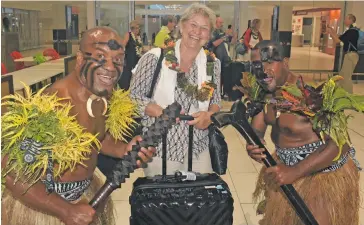  ?? Photo: Waisea Nasokia ?? Passenger Brigitte Siber with traditiona­l Fijian warriors Kitione Nawaite (left) and Epeli Katisawani after disembarki­ng from the Edelweiss Air chartered aircraft at the Nadi Internatio­nal Airport on September 13, 2018.