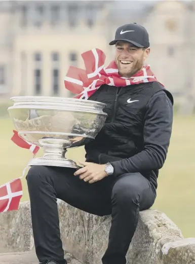  ??  ?? 0 Lucas Bjerregaar­d with the trophy at the Old Course and, left, Tyrrell Hatton, who appeared to run out of gas.