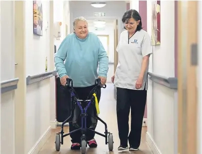  ?? Picture: SWNS. ?? Sheila Pirie walking with her nurse Kate Barry.