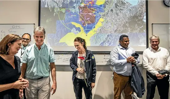  ?? BRADEN FASTIER/ STUFF ?? Prime Minister Jacinda Ardern with the Tasman and Nelson mayors during a visit to the Nelson Tasman Emergency Coordinati­on Centre on Thursday.