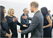  ??  ?? Much to do: the Duke and Duchess of Cambridge, Prince Harry and Meghan Markle (main) at the first Royal Foundation Forum in London. Left, Prince Harry and Meghan greet Bryony Gordon