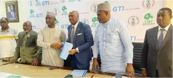  ?? ?? L-R: NFF Director of Finance, Mr. Babatunde Akinsanya; Secretary General, Dr. Mohammed Sanusi; President, Ibrahim Musa Gusau; GMD GTI, Abubakar Lawal; Chairman, Marketing and Sponsorshi­p of NFF, Alhaji Sharif Rabiu Inuwa and Executive Director GTI, Nelson Ine at the signing ceremony of the FA Cup partnershi­p between the NFF and GTI in Abuja