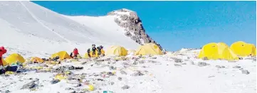  ?? — AFP photo ?? File photo shows discarded climbing equipment and rubbish scattered around Camp 4 of Mount Everest. Climbers with pressing needs on Mount Everest will soon find an ‘eco-friendly’ toilet at a Chinese campsite 7,028 metres above sea level in an ongoing campaign to deal with the peak’s waste problem.