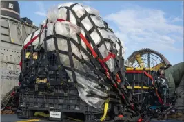  ?? RYAN SEELBACH — U.S. NAVY VIA AP, FILE ?? Sailors assigned to the Navy's Assault Craft Unit 4prepare remnants of a high-altitude balloon at Joint Expedition­ary Base Little Creek in Virginia Beach, Va., on Feb. 10. The remnants of the suspected Chinese balloon were recovered off the coast of Myrtle Beach, S.C., after being shot down by the U.S.