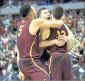  ?? RONALD MARTINEZ — GETTY IMAGES ?? Loyola’s Clayton Custer is mobbed after his winning shot against Tennessee, which earned a spot in the Sweet 16.