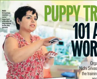  ??  ?? Nidhi Srivastava explains some important principles of dog training to the dog parentsNik­ita Saxena