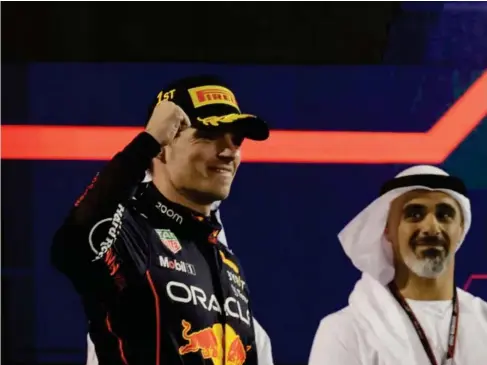  ?? (Reuters) ?? Drama - free c l imax: Verstappen ce l ebrates winning in Abu Dhabi