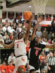  ?? Scott Herpst ?? Lafayette guard Jaylon Ramsey drives to the hoop against LFO’S Jamichael Davis. Ramsey had 10 points in the Ramblers’ 65-51 victory on Friday night.