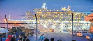  ??  ?? Journalist­s gather to film the quarantine­d ship Diamond Princess at Yokohama port near Tokyo on Monday.
AP