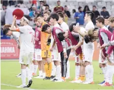  ?? — Reuters photo ?? Japan players bow after the match.