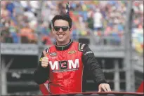  ?? AP PHOTO/JOHN RAOUX, FILE ?? Timmy Hill takes a parade lap before the Daytona 500 in Daytona Beach, Fla. Feb. 16, 2020. His iRacing victory on national television gave Hill and his sponsors exposure they’d never receive during a normal NASCAR weekend.