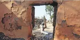  ?? Reuters, AFP ?? An Indian villager performs prayers outside his house that was gutted following firing from the Pakistan border, at Jora farm village, in Ranbir Singh Pura district near Jammu.