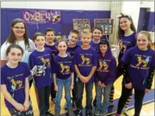  ??  ?? Ballston Spa High School senior Maddie Welch, top left, is joined by the Milton Terrace school Cyborg Unicorns team.