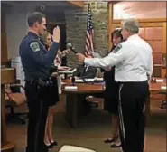  ?? PHOTO COURTESY OF UPPER PROVIDENCE TOWNSHIP ?? Newly promoted Cpl. Ryan Sheehan takes the oath of office before Upper Providence Township Board of Supervisor­s’ Chairwoman Lisa Mossie and Police Chief Mark Toomey Tuesday night.