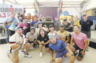  ?? ?? O cials of the organizing The IRONMAN Group/Sunrise Events, Inc. and the sponsoring Alveo Land Corp., along with supporters whoop it up during Friday’s medal presentati­on for the Alveo IRONMAN 70.3 Davao set Sunday at the Azuela Cove.