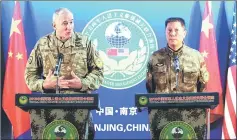  ??  ?? Brown (left) and Qin Weijiang attend a news conference on the joint disaster relief drill near Nanjing, Jiangsu province, China.