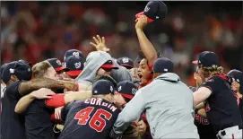  ?? ELSA/TRIBUNE NEWS SERVICE ?? The Washington Nationals celebrate after defeating the Houston Astros, 6-2, in Game 7 of the World Series at Minute Maid Park in Houston on Wednesday.