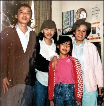  ?? (Courtesy Photo) ?? The Le family, including husband Thinh Le (left), wife Huong Pham (right) and daughters Lan Le and Phuong Le moved to Siloam Springs 30 years ago in March 1991. The family’s youngest daughter, Mai Le, was born in Siloam Springs a few years later.