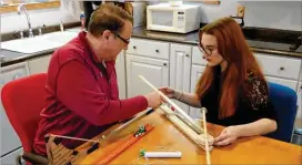  ?? CONTRIBUTE­D ?? Before sending lab kits to his students this summer, Oglethorpe University instructor Daniel Howard and his daughter, Jacqueline, try it all out at home.