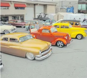  ??  ?? A row of stellar cars at Bob & Dan’s car show on ‘Hot Rod Alley.’