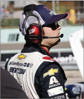  ?? (AP/Terry Renna) ?? William Byron of Hendrick Motorsport­s stands on pit road during a NASCAR Cup Series practice at Homestead-Miami Speedway on Saturday in Homestead, Fla. Byron will race from the pole today after turning in a lap of 32.454 seconds. It’s the eighth pole of his career and the first time he’s racing from the No. 1 position this season.