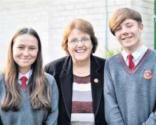  ??  ?? Rosie Cooper MP with head girl Lucy McDonough and head boy Matthew Johnson at Our Lady Queen of Peace