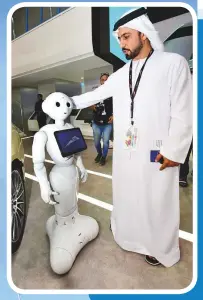  ?? Atiq Ur Rehman/Gulf News ?? Mohammad Al Khayyat, Director Smart Services demonstrat­ing the new RTA robot Mahboub which can answer any question and offer 90 RTA services at the RTA Stand during Gitex 2018.