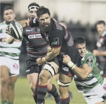  ??  ?? Edinburgh forward Cornell Du Preez is stopped in his tracks by a Benetton tackler.