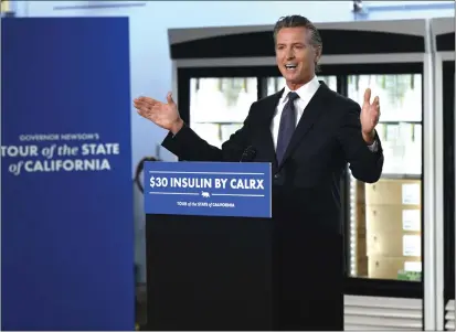  ?? PHOTOS BY KEITH BIRMINGHAM — STAFF PHOTOGRAPH­ER ?? Gov. Gavin Newsom speaks about his plan to have insulin available to everyone for $30at a news conference at Kaiser Permanente's central refill pharmacy in Downey on Saturday. He says it will save California patients between $2,000and $4,000annuall­y.