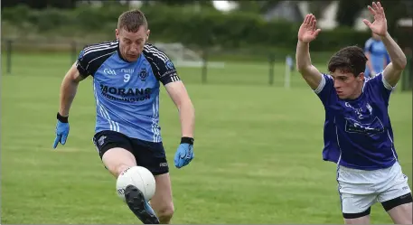  ??  ?? St. Colmcille’s Robbie McCloskey takes onJames Mooney (Meath Hill) during their Division 2 clash.
