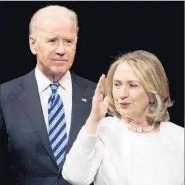  ?? Cliff Owen Associated Press ?? VICE PRESIDENT Joe Biden with Hillary Rodham Clinton in 2013. Some analysts think a Biden candidacy would help sharpen Clinton’s campaign approach.