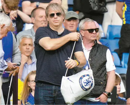  ?? AP-Yonhap ?? American businessma­n Todd Boehly attends the English Premier League football match between Chelsea and Watford at Stamford Bridge stadium in London, Sunday. The Premier League has approved the proposed sale of Chelsea to a consortium fronted by Los Angeles Dodgers part-owner Todd Boehly, although the U.K. government still needs to sign off on the deal before it can be completed.