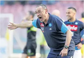  ??  ?? Napoli coach Sarri reacts during a Serie A game.