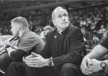  ?? SAM HOGDSON / THE NEW YORK TIMES ?? The Rev. Rob Hagan, Villanova’s team chaplain, watches the team during a game March 12 at Madison Square Garden in New York. Villanova has a beloved, long-tenured basketball team chaplain, too, but he wants no part of a Final Four rivalry with Loyola-chicago’s Sister Jean. “I always learned that you respect the nuns,” Hagan joked.