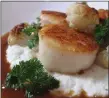  ?? PHOTO BY CURT NORRIS ?? Sautéed scallops are served atop a creamy bed of pureed cauliflowe­r.