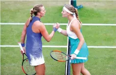  ??  ?? Czech Republic’s Petra Kvitova (left) shakes the hand of France’s Kristina Mladenovic as she celebrates winning her quarter final match . - Reuters photo