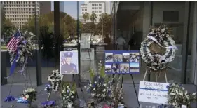  ?? AP PHOTO/MARCIO JOSE SANCHEZ ?? A memorial for slain police officer Juan Diaz is placed outside of Los Angeles Police Department headquarte­rs on Tuesday, in Los Angeles.