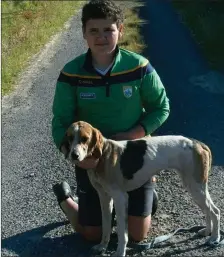  ??  ?? Luke Harty from the Ballinskel­ligs Club with his senior pup Miss Kelly, winner of the Margaret Murray Memorial Drag Hunt at Portmagee