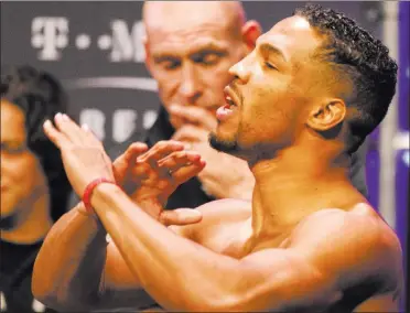  ?? Heidi Fang ?? THEN-UFC lightweigh­t contender Kevin Lee gestures at Tony Ferguson, not pictured, during the weighins for their
Oct. 7 meeting at T-mobile Arena. Lee lost to Ferguson, snapping a fivebout win streak, and is now trying to re-establish himself in the...