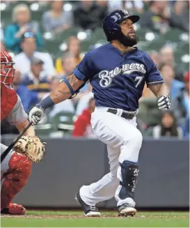  ?? GETTY IMAGES ?? Eric Thames watches his home run in the first inning. Thames hit a pair of blasts on Monday night and has seven home runs against the Reds in five games.