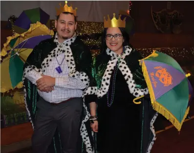  ?? (Special to The Commercial/Richard Ledbetter) ?? 2024 St. Peter Mardi Gras Prince and Princess Alfonso and Helen Perez take their crowning walk around the room.