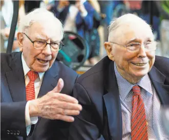  ?? Nati Harnik / Associated Press ?? Berkshire Hathaway Chairman and CEO Warren Buffett (left) and the lesser known Vice Chairman Charlie Munger before their company’s annual meeting where they answer questions.