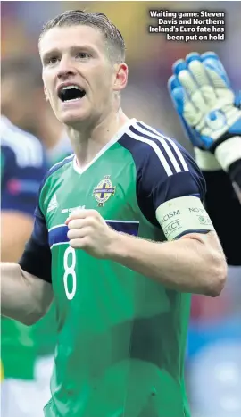  ??  ?? Waiting game: Steven
Davis and Northern Ireland’s Euro fate has
been put on hold