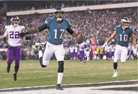  ?? Al Bello / Getty Images ?? Alshon Jeffery celebrates his 53-yard touchdown grab in the second quarter. He added a 5-yard TD grab in the fourth quarter.