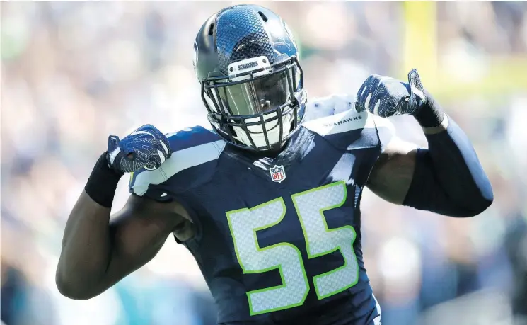  ?? — GETTY IMAGES FILES ?? Seattle Seahawks defensive end Frank Clark celebrates after sacking Ryan Tannehill of the Miami Dolphins earlier this season, one of his 14 on the year.