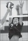  ??  ?? JASON KRYK/The Windsor Star Massey’s Kevin Xue tries to block a spike against Holy Names during WECSSAA volleyball action Thursday.